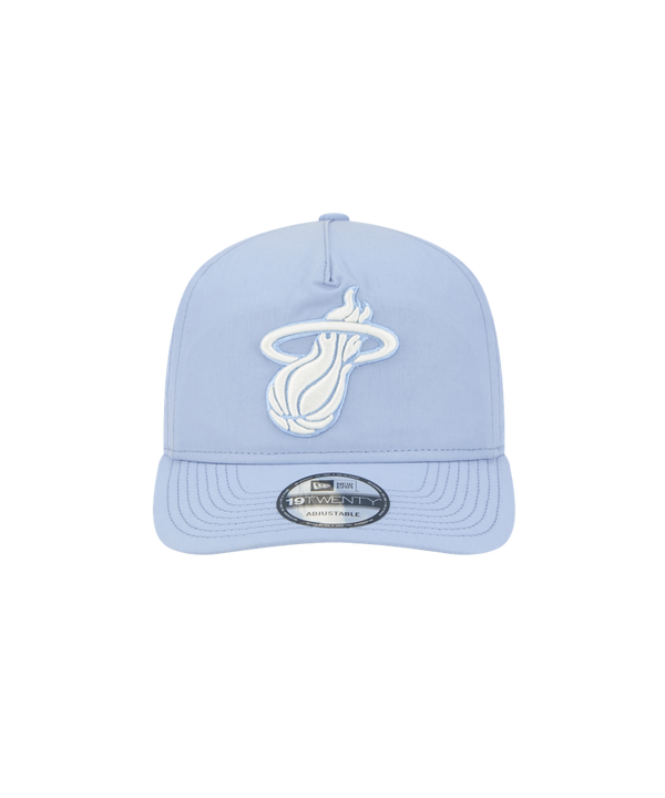 The New Era Miami HEAT Nylon Blue Snapback features a light blue cotton nylon design, pre-curved visor, white Miami Heat logo on the front, and a silver 9TWENTY Adjustable sticker on the brim, shown against a plain white background.