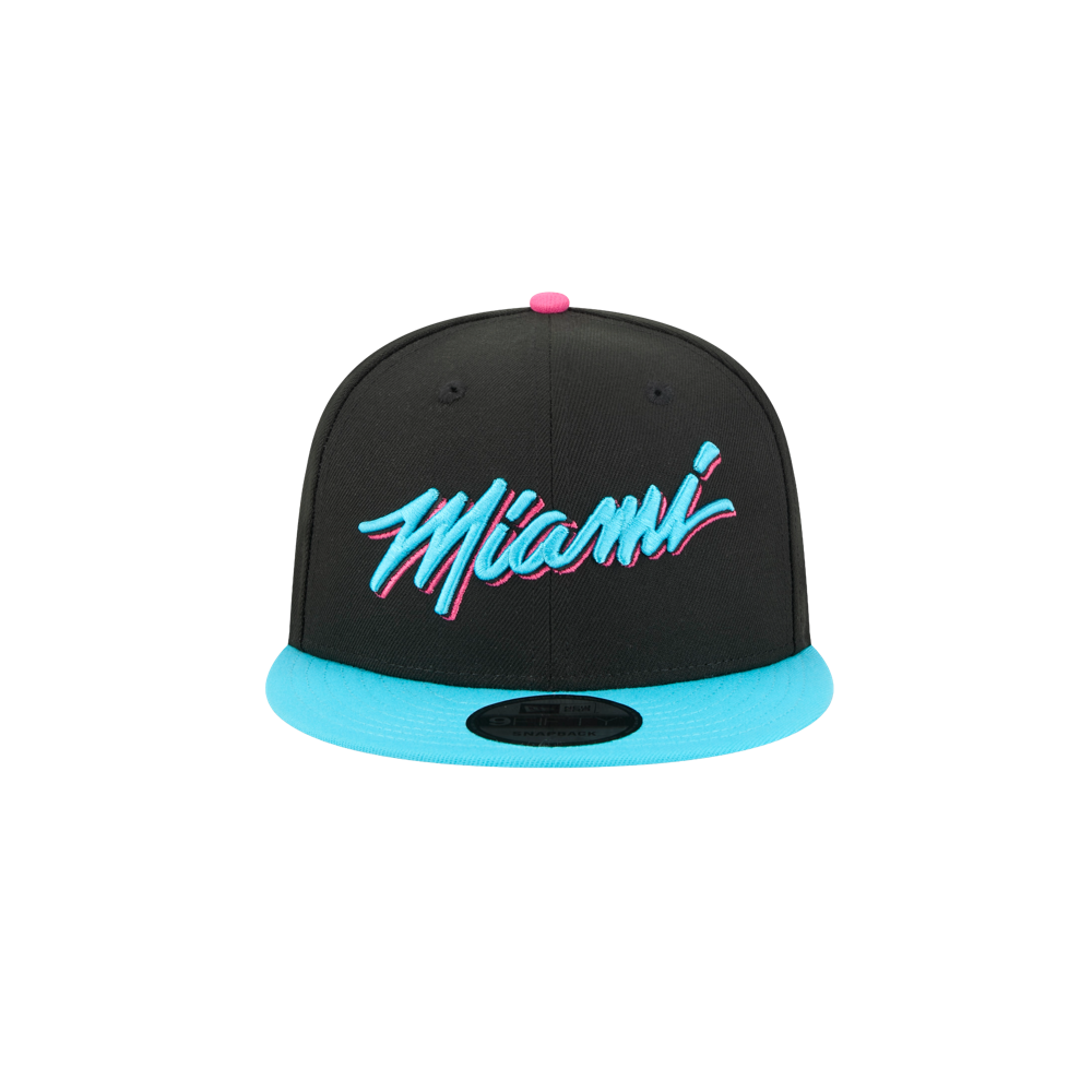 The New Era Miami HEAT Original Vice Nights Snapback features a black design with a bright blue brim, stylized pink and blue Miami embroidery, a pink top button, polyester fabric, one size fits most, and is spot clean only.