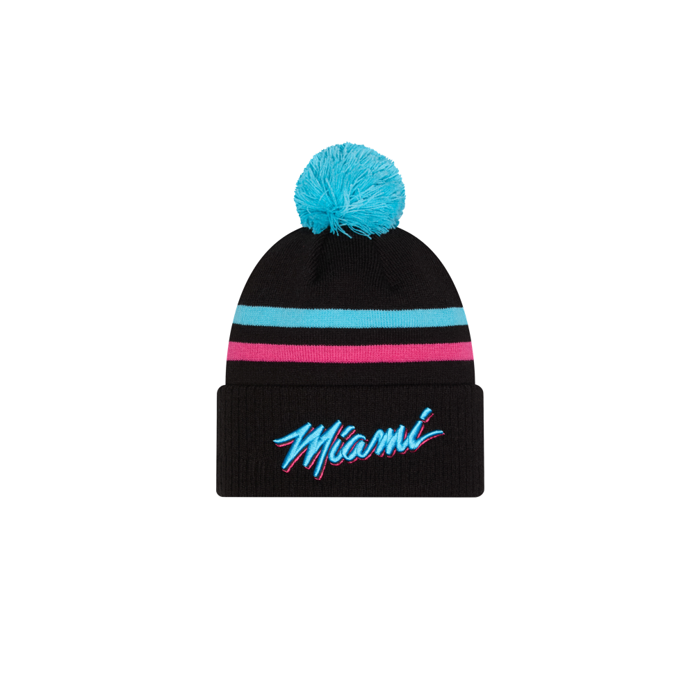 The New Era Miami HEAT Original Vice Nights Knit is a black acrylic beanie with a blue pom-pom, turquoise and pink stripes, and “Miami” embroidered on the front cuff. One size fits most; spot clean for best care.