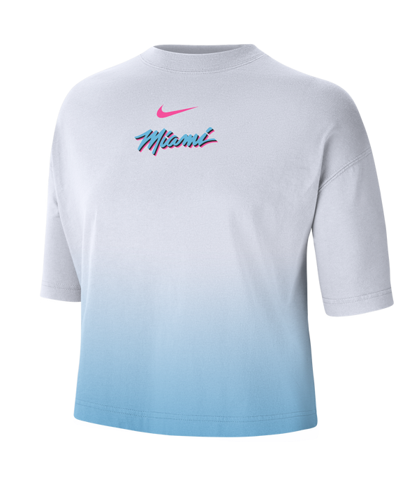 The Nike Miami HEAT Original Vice Nights Women's Boxy Tee is a loose-fit, short-sleeve cotton shirt in a white and light blue gradient, featuring a pink Nike Swoosh and 