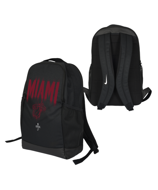 Two views of the Nike Miami HEAT Backpack: one side displays “MIAMI” in red lettering along with the team’s logo, while the other showcases padded shoulder straps featuring a white Nike logo. The backpack by Nike also includes a spacious zippered compartment for convenient storage.