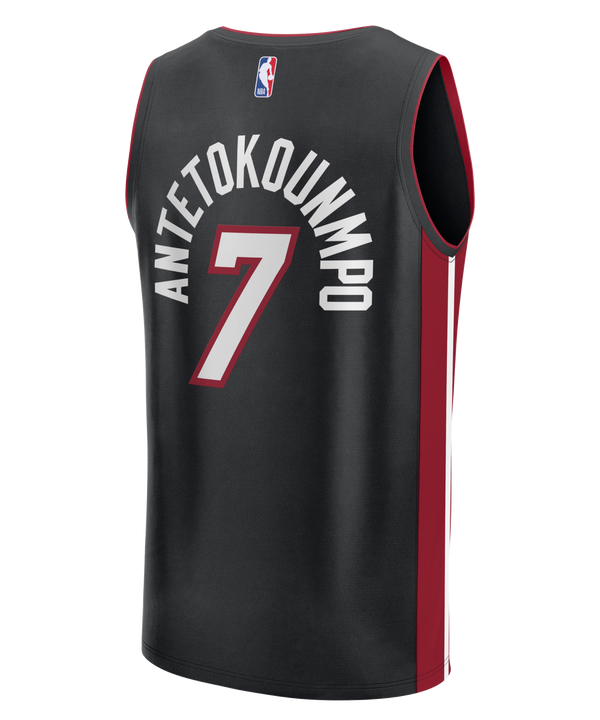 Show your team pride with the Giannis Antetokounmpo Miami HEAT Icon Black Replica Jersey by Fanatics. This sleek black basketball jersey features MIAMI in bold white and red lettering, with the number 7 on the front. The striking maroon side panels add an eye-catching detail, while the official NBA logo is displayed at the hem—perfect for any Miami HEAT fan wanting to represent their team in authentic style.