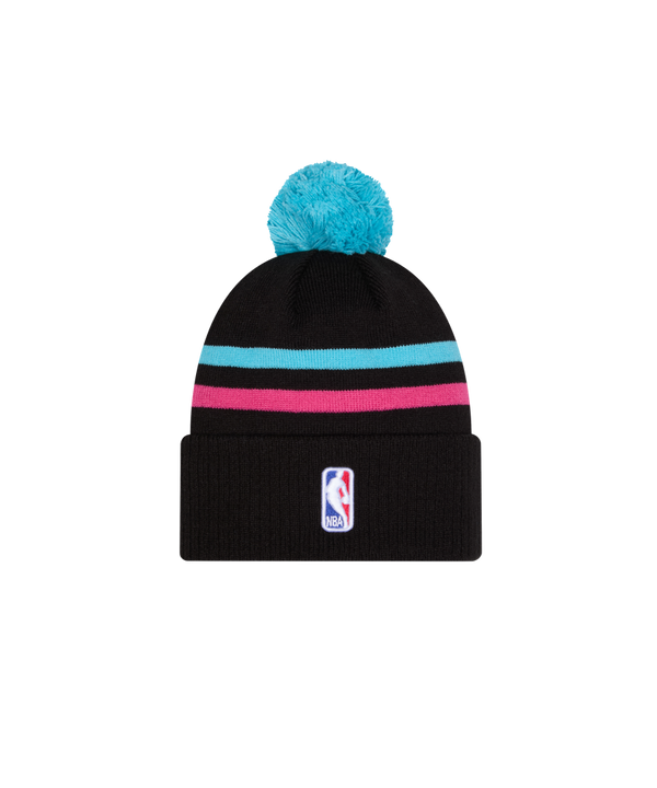 The New Era Miami HEAT Original Vice Nights Knit is a black acrylic beanie with a blue pom-pom, turquoise and pink stripes, and “Miami” embroidered on the front cuff. One size fits most; spot clean for best care.