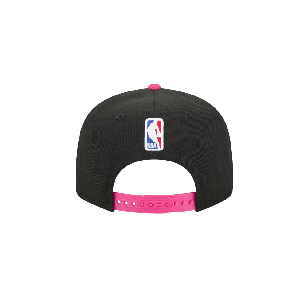 Back view of the New Era Miami HEAT Original Vice Nights Snapback, a black polyester cap with the NBA logo above the opening and a bright pink adjustable snapback strap. One size fits most; spot clean recommended. Brand: New Era.