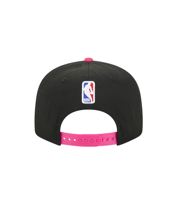 The New Era Miami HEAT Original Vice Nights Snapback features a black design with a bright blue brim, stylized pink and blue Miami embroidery, a pink top button, polyester fabric, one size fits most, and is spot clean only.