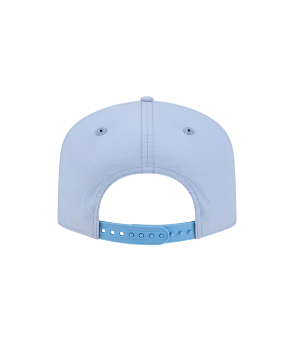 The New Era Miami HEAT Nylon Blue Snapback features a light blue cotton nylon design, pre-curved visor, white Miami Heat logo on the front, and a silver 9TWENTY Adjustable sticker on the brim, shown against a plain white background.