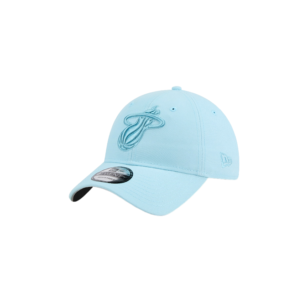 The New Era Miami HEAT Light Blue Color Pack Dad Hat is a polyester baseball cap with an embroidered Miami Heat logo on the front and a New Era logo on the side. One size fits most. Spot clean. Shown on a plain white background.