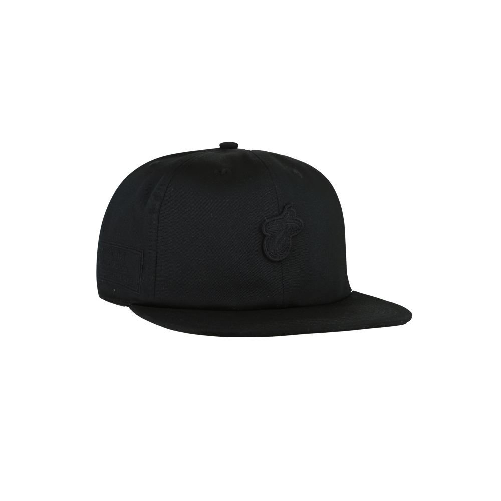 The '47 Brand Miami HEAT Captain Black Snapback, a flat-brim cotton hat with subtle front embroidery, is shown at an angle on a white background; one size fits most and spot cleaning is recommended.