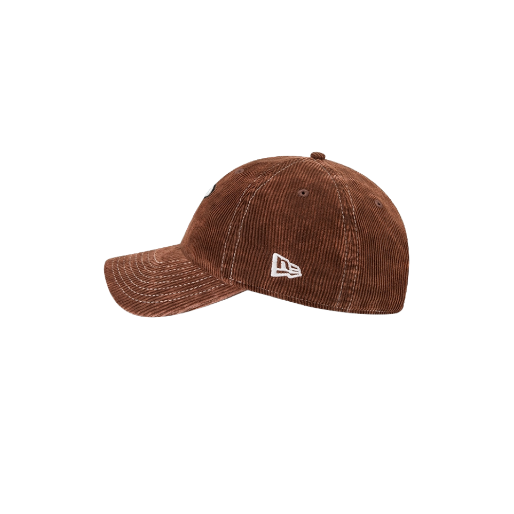 The New Era Miami HEAT Brown Corduroy Dad Hat features a curved brim and a white embroidered logo on the side. Crafted from soft cotton corduroy for comfort and a casual look, this classic cap comes in a one-size-fits-most design and is displayed against a plain white background.