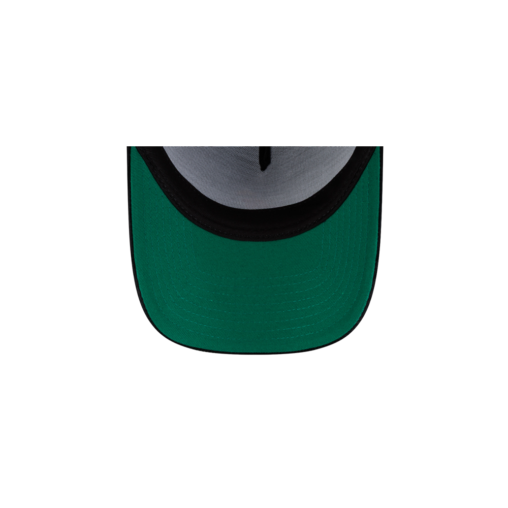 Top-down close-up of a Court Culture x New Era Corduroy Logo Dad Cap, featuring a solid green brim and dark interior lining.