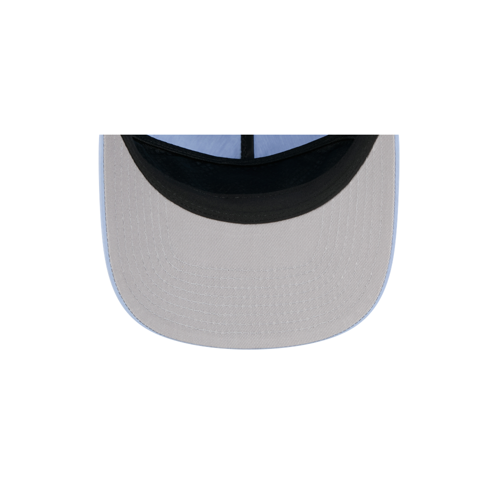 Top-down view of the New Era Miami HEAT Nylon Blue Snapback shows its pre-curved visor, black inner band, and light blue edge, all set against a plain white background.