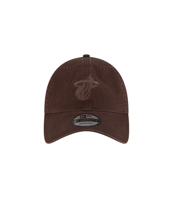 The Court Culture Ball & Flame Chocolate Dad Hat features a brown cotton build, embroidered Miami Heat logo, curved brim, adjustable back strap, and a one-size-fits-most design. Spot clean for best care.