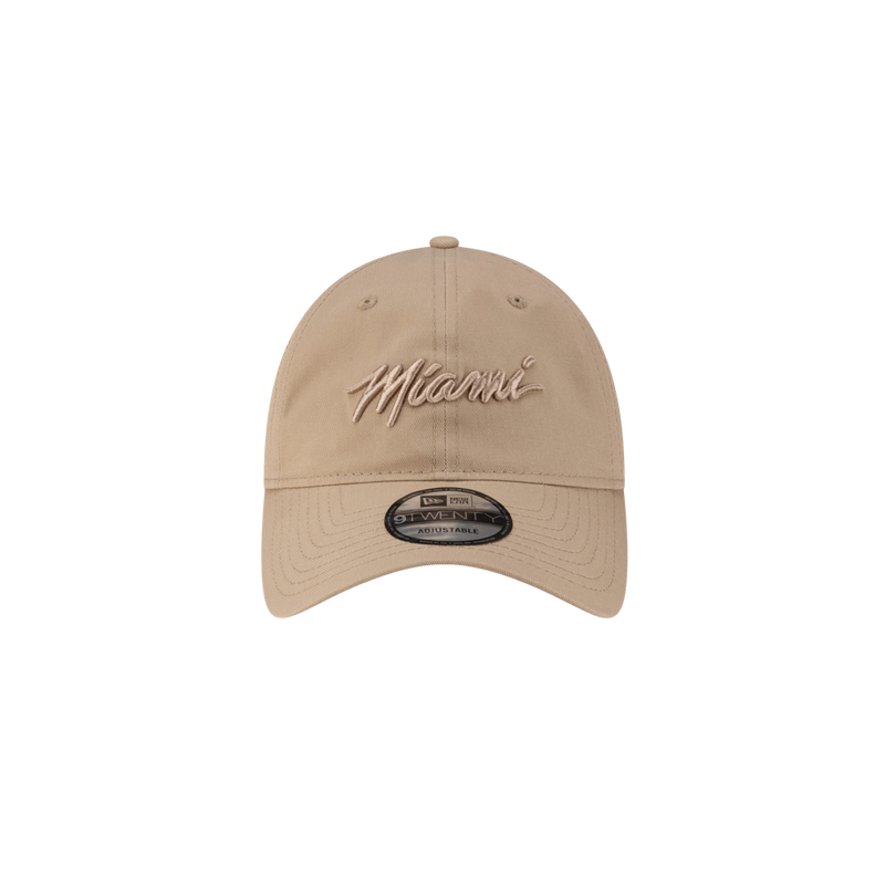 The Court Culture Original Vice Nights Wordmark Dad Hat in sand features "Miami" embroidered in cursive on the front, a brim sticker with size and brand info, and a one-size-fits-most design. Plain white background. Spot clean only for best care.
