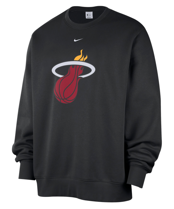 Experience everyday comfort with the Nike Miami HEAT Logo Fleece Crewneck. This black sweatshirt showcases the Miami Heat basketball team logo prominently on the chest, topped with a small white Nike Swoosh. Made from a soft cotton-polyester blend in a standard fit, it’s ideal for daily wear—just wash with like colors to keep it looking fresh.