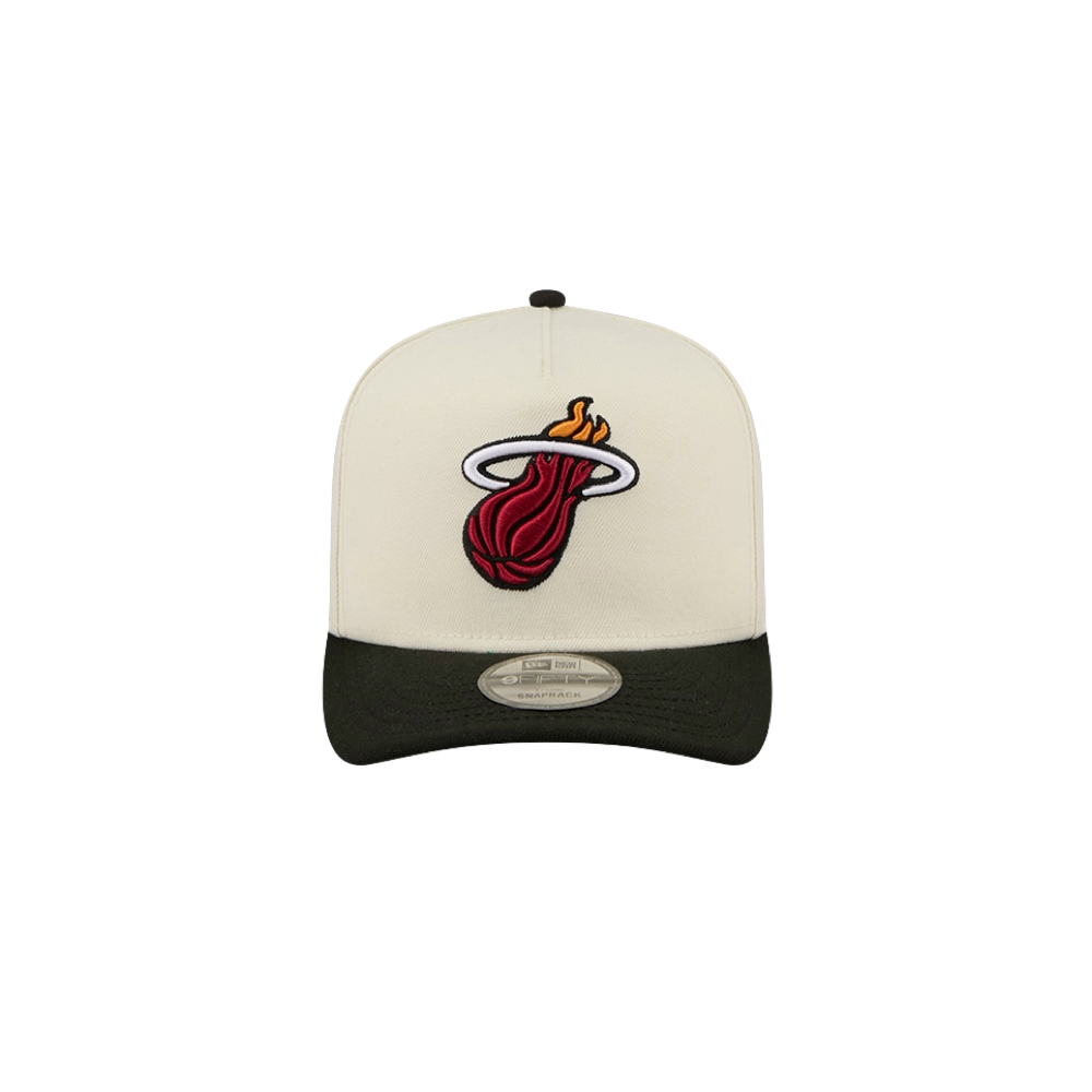 The New Era Miami HEAT Logo Wordmark Snapback is a white and black polyester cap showcasing the Miami Heat basketball team logo—a flaming basketball passing through a hoop—prominently on the front. Designed by New Era in a one size fits most style, this hat is easy to care for with simple spot cleaning.
