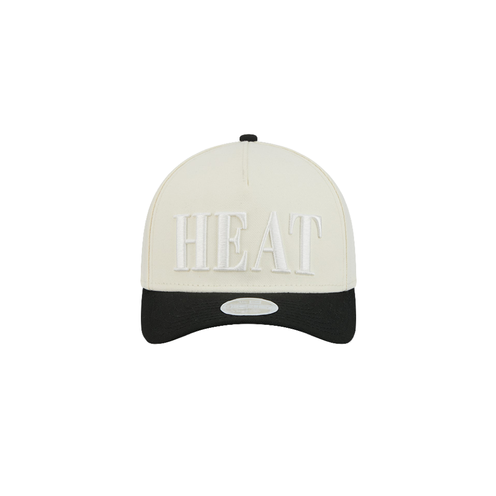 A white and black polyester New Era Miami HEAT 2-Tone Tonal Women’s Snapback features “HEAT” embroidered in large white letters on the front. This adjustable New Era cap is designed for comfort and style, ensuring a one-size-fits-most fit.