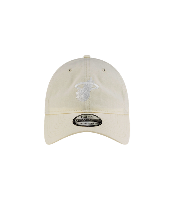 The Court Culture Ball & Flame Ivory Dad Hat by Court Culture features a white embroidered Miami Heat logo on beige cotton, a silver New Era sticker on the brim, and comes in one size that fits most. Easy to spot clean. Displayed against a plain white background.