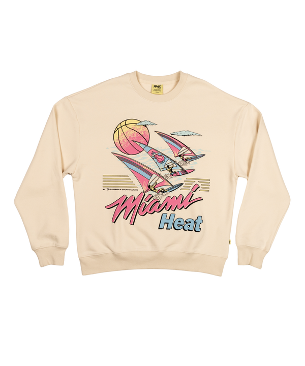 The Court Culture x Duvin Ivory Sweater by Court Culture is a cream heavyweight fleece crewneck with a vintage Miami Heat graphic featuring sailboats, a large basketball sun, pastel hues, and retro Miami Heat pink and blue lettering.