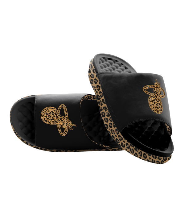 The ISlide Miami HEAT Cheetah Dip Sandals feature black straps with gold snake accents, a subtle cheetah print edge, and a textured, quilted massaging footbed for all-day comfort.