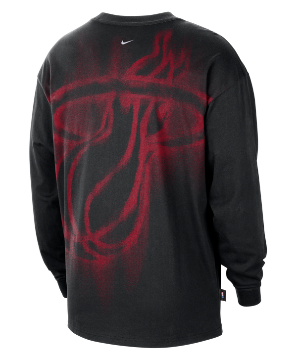 A Nike Miami HEAT Game Long Sleeve Tee in black, made from polyester with sweat-wicking technology, features a small white Nike logo and text on the chest, shown against a plain white background.