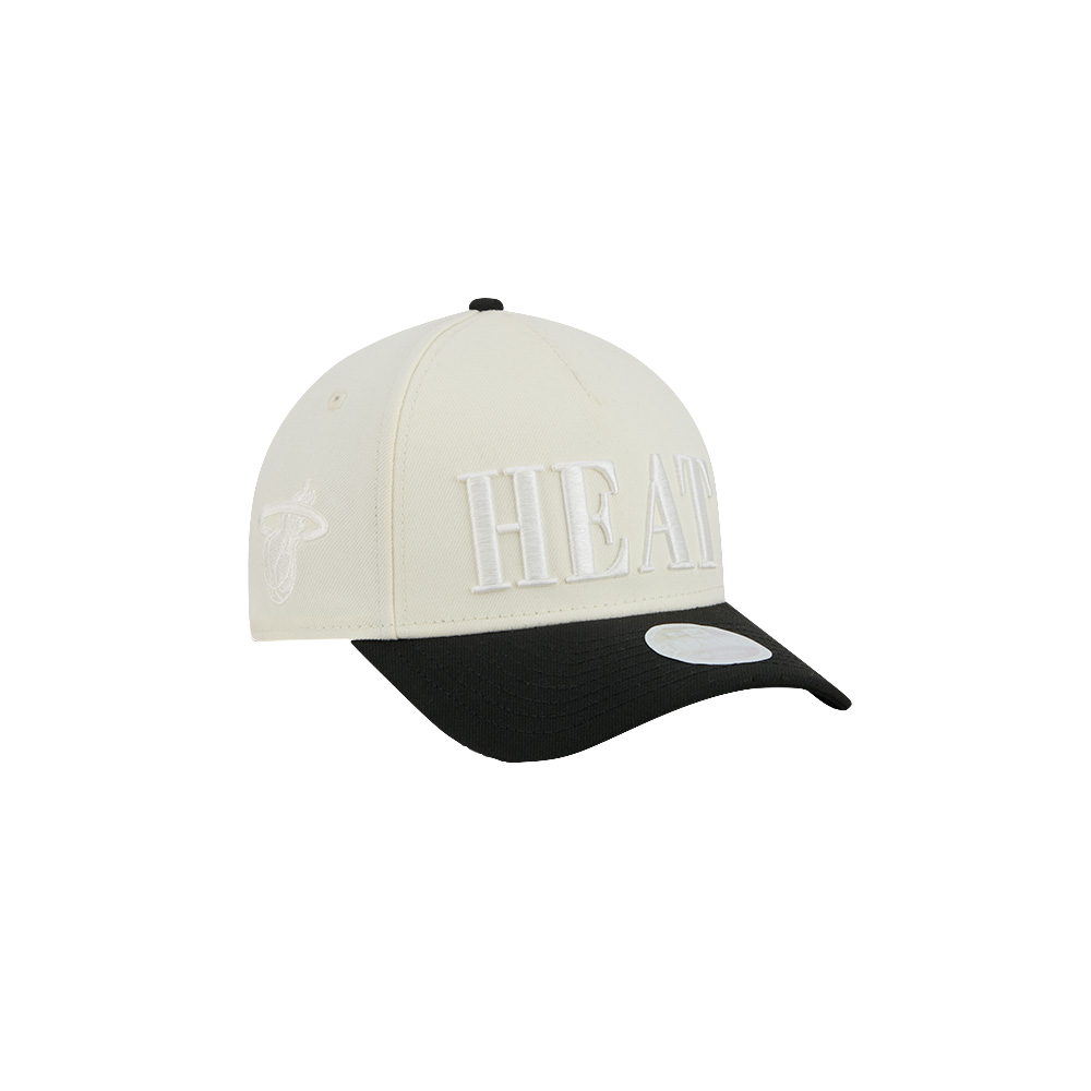 The New Era Miami HEAT 2-Tone Tonal Women’s Snapback is a cream and black polyester hat featuring bold white HEAT text on the front panel and a stitched team logo on the side. Designed by New Era, this adjustable hat offers a one size fits most style for maximum comfort.