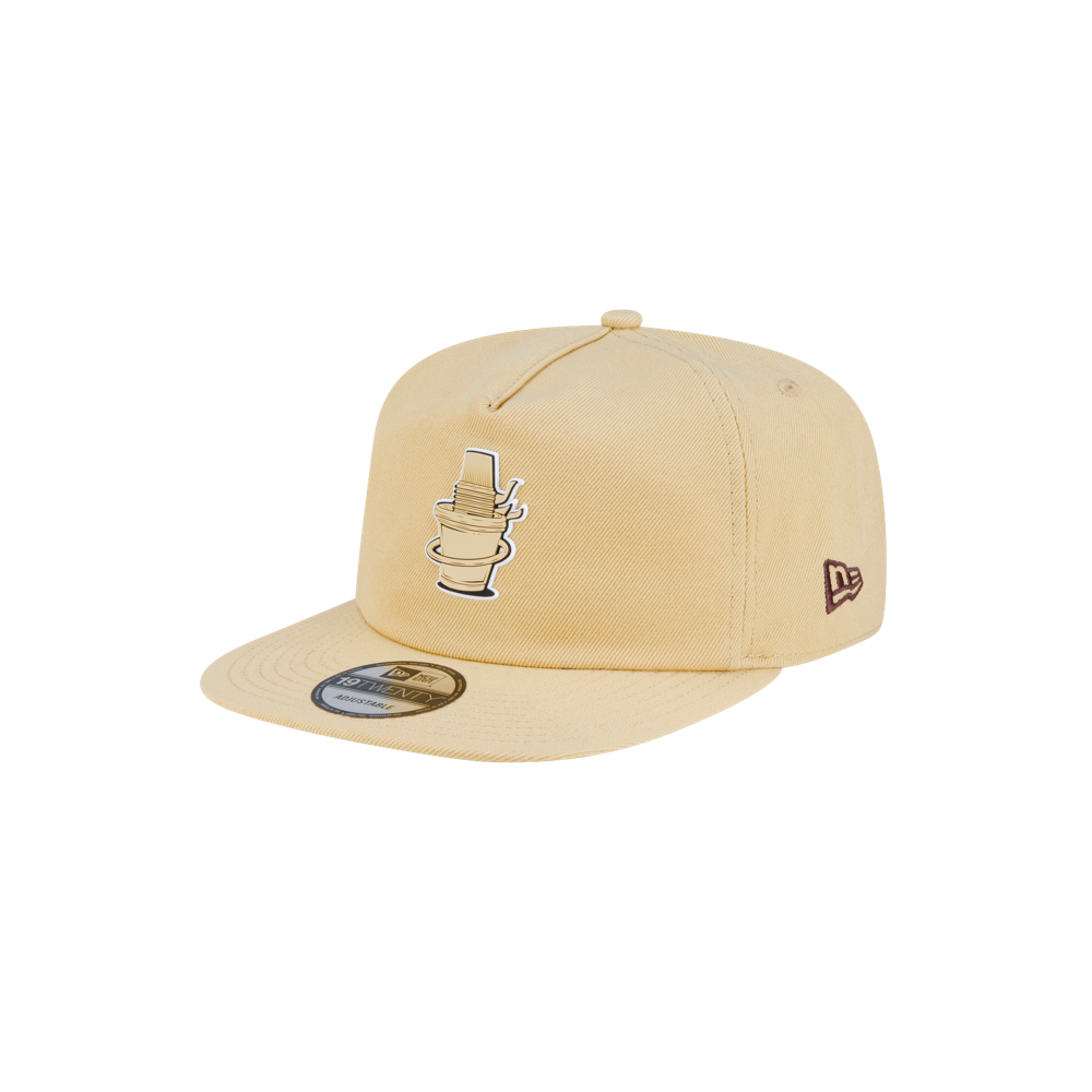 Court Culture x New Era Colada tan polyester snapback hat with a flat brim and an embroidered tropical drink graphic on the front.
