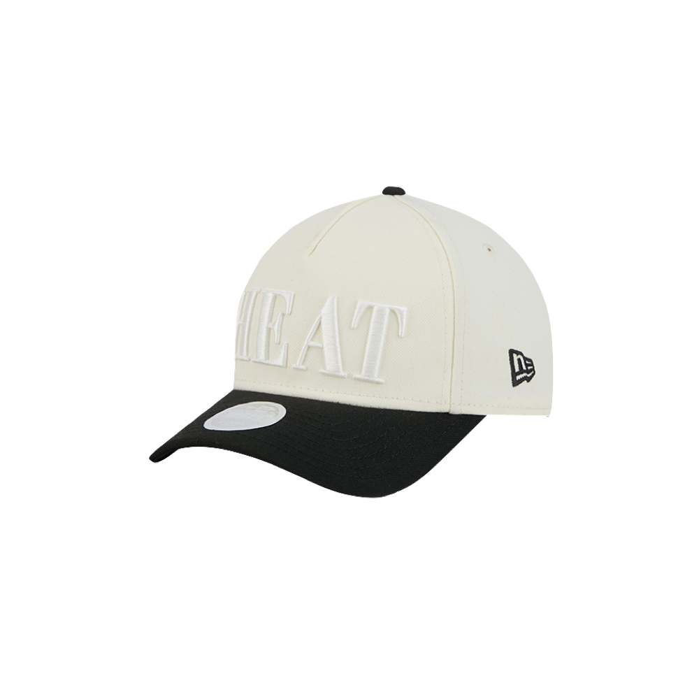 The New Era Miami HEAT 2-Tone Tonal Women’s Snapback is a white and black adjustable hat featuring the word “HEAT” embroidered in large white letters on the front and a small New Era logo on the side. This one-size-fits-most polyester snapback hat by New Era combines style and comfort for everyday wear.