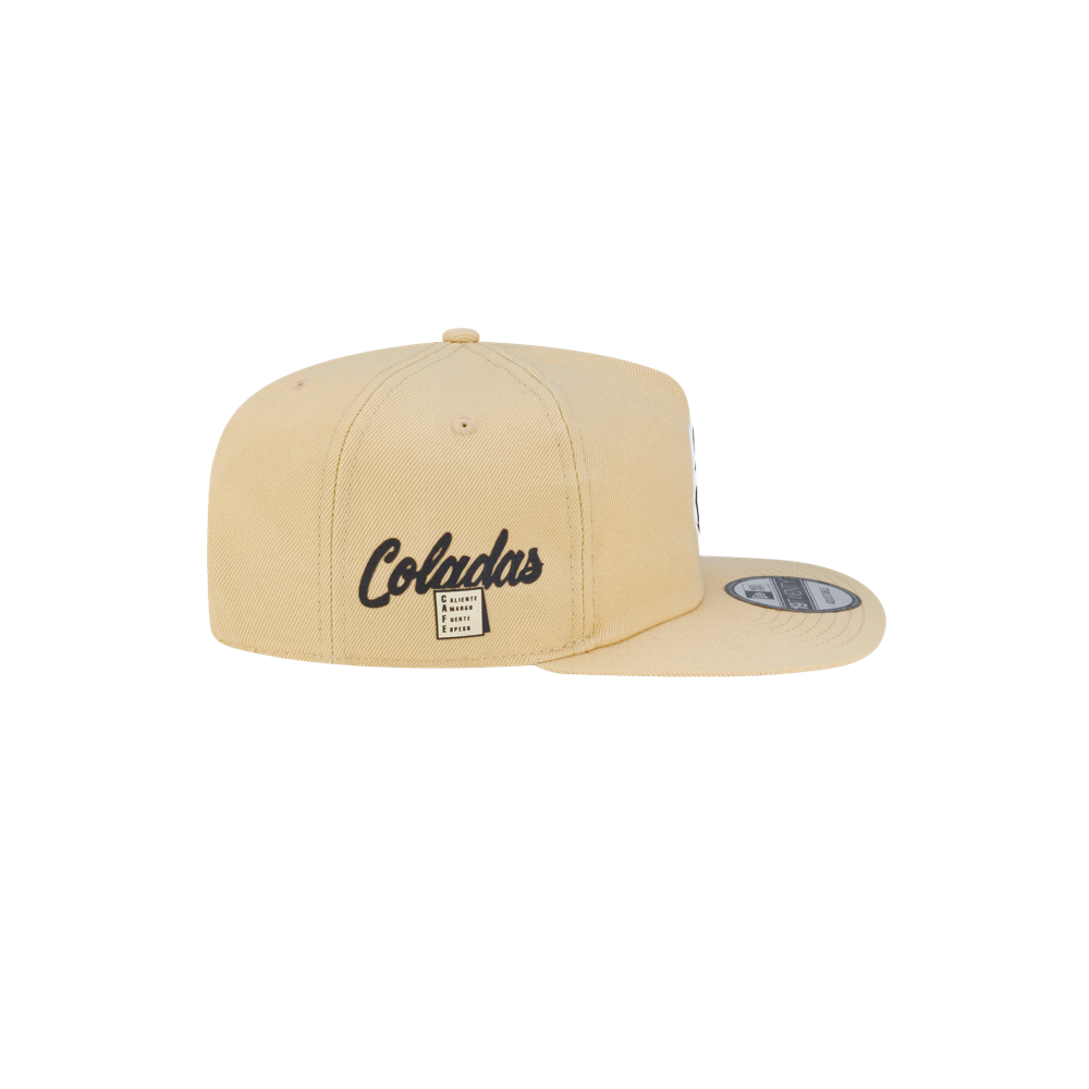 Tan polyester Court Culture x New Era Colada snapback hat with the word Coladas embroidered on the side above a small square label.