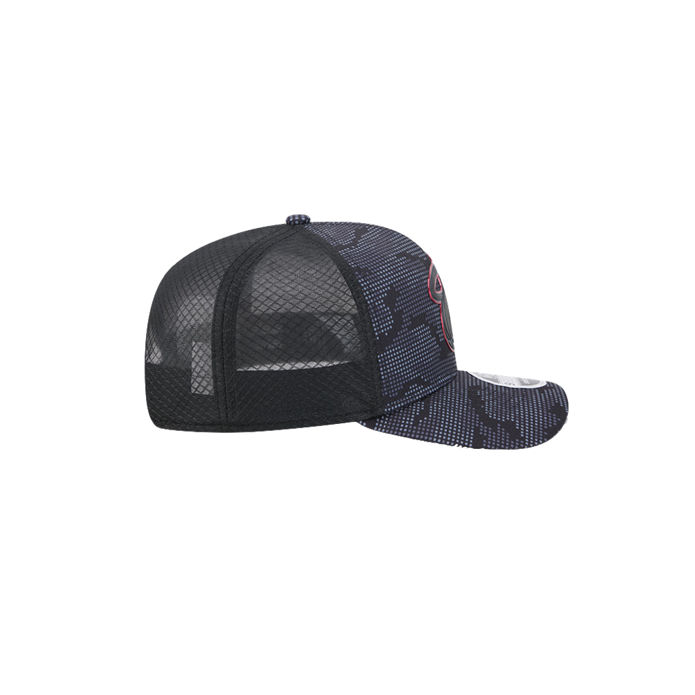 New Era Miami HEAT Tonal Camo Snapback by New Era, featuring black mesh trucker panels and a dark blue camouflage pattern on the front panels and brim. Displayed from a side angle against a plain white background, this polyester snapback offers cooling stretch-snap technology for enhanced comfort.