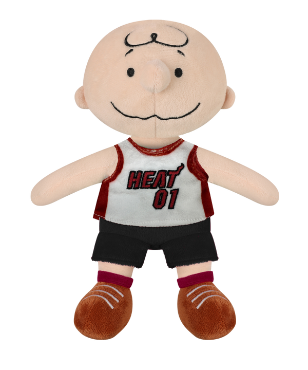 The Miami HEAT Charlie Brown Jersey Plush by Forever Collectibles features a bald cartoon boy in a white and red HEAT 01 jersey, black shorts, and brown shoes. Made of soft polyester fiber, it's surface washable and perfect for ages 3+.