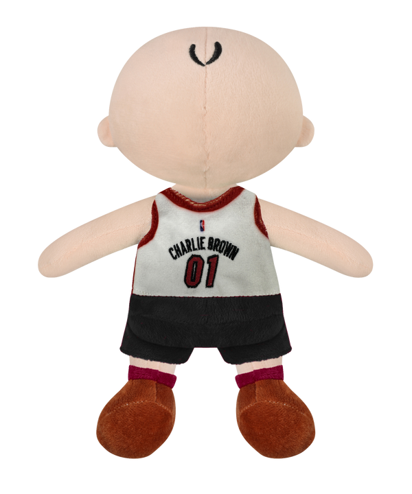 The Miami HEAT Charlie Brown Jersey Plush by Forever Collectibles features a bald cartoon boy in a white and red HEAT 01 jersey, black shorts, and brown shoes. Made of soft polyester fiber, it's surface washable and perfect for ages 3+.