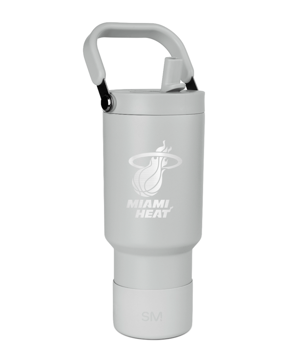 The Simple Modern Miami HEAT Logo Pivot Tumbler is a light gray stainless steel travel mug with a handle, straw lid, double wall insulation, team logo, and 