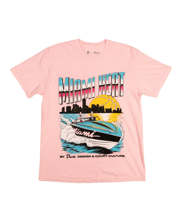 The Court Culture x Duvin Boat Tee is a light pink pre-shrunk T-shirt featuring a colorful speedboat, city skyline, sunset, bold “Miami Heat,” and “By D Wade Design & Court Culture” in the signature Court Culture style.