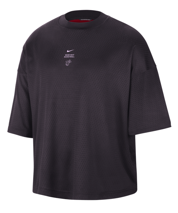 The Nike Miami HEAT Standard Issue Logo Game Tee is a loose-fitting, short-sleeve black t-shirt featuring a small white Nike logo and text on the chest. Crafted from washable polyester for a relaxed fit, it is displayed on a plain white background.