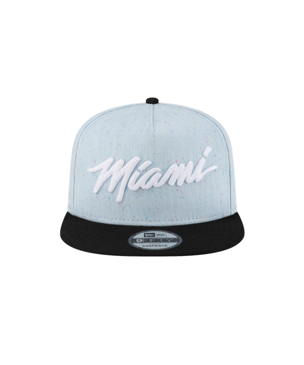 The Court Culture Original Vice Nights Wordmark Snapback in denim and black features “Miami” in bold white script on the front, a black cotton visor, a New Era sticker, and is one size fits most. Displayed against a plain white background.