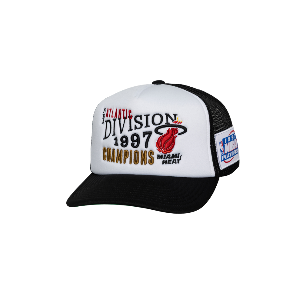 The Mitchell & Ness Miami HEAT Division Champ Trucker Snapback is a black and white polyester hat with embroidered 
