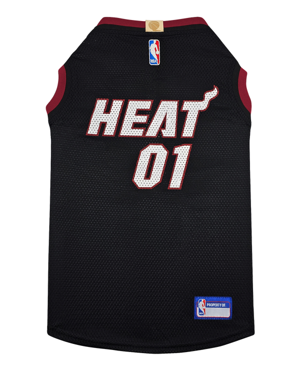 The Pets First Miami HEAT Pet Jersey features black mesh with red trim, HEAT 01 in white and red on the back, an NBA logo on the neck, and a small NBA Properties patch—ideal sports apparel for your dog’s jersey collection.