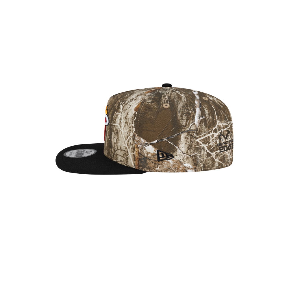 Court Culture x New Era Camo Snapback A-frame cap with a woodland camouflage pattern, black cotton visor, and front embroidered logo.