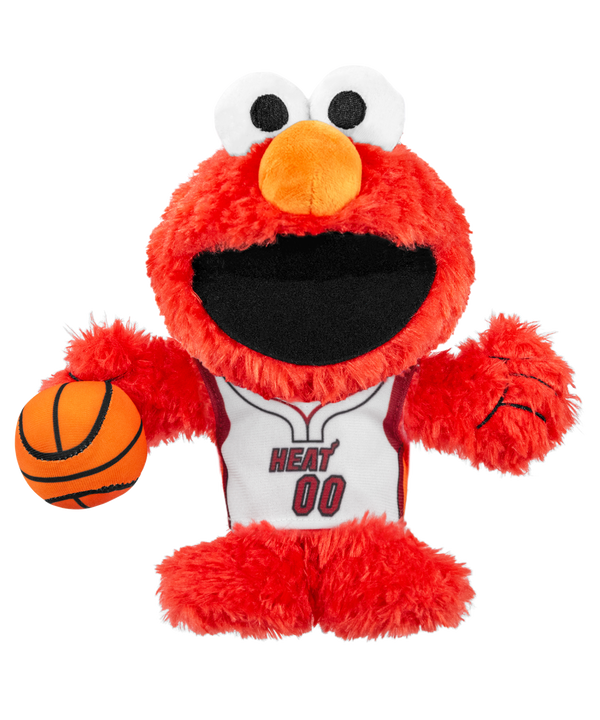 The Bleacher Creatures Miami HEAT Elmo Association Plushie features Sesame Street’s Elmo wearing a white Miami HEAT jersey with “Heat 00,” and holding an orange basketball in his left hand.