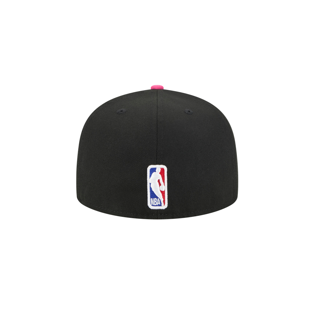 The New Era Miami HEAT Original Vice Nights Fitted Hat is a black polyester cap shown from the back with the NBA logo embroidered in red, white, and blue. It features a pink top button, fitted shape, no visible fasteners, and spot clean care is recommended.