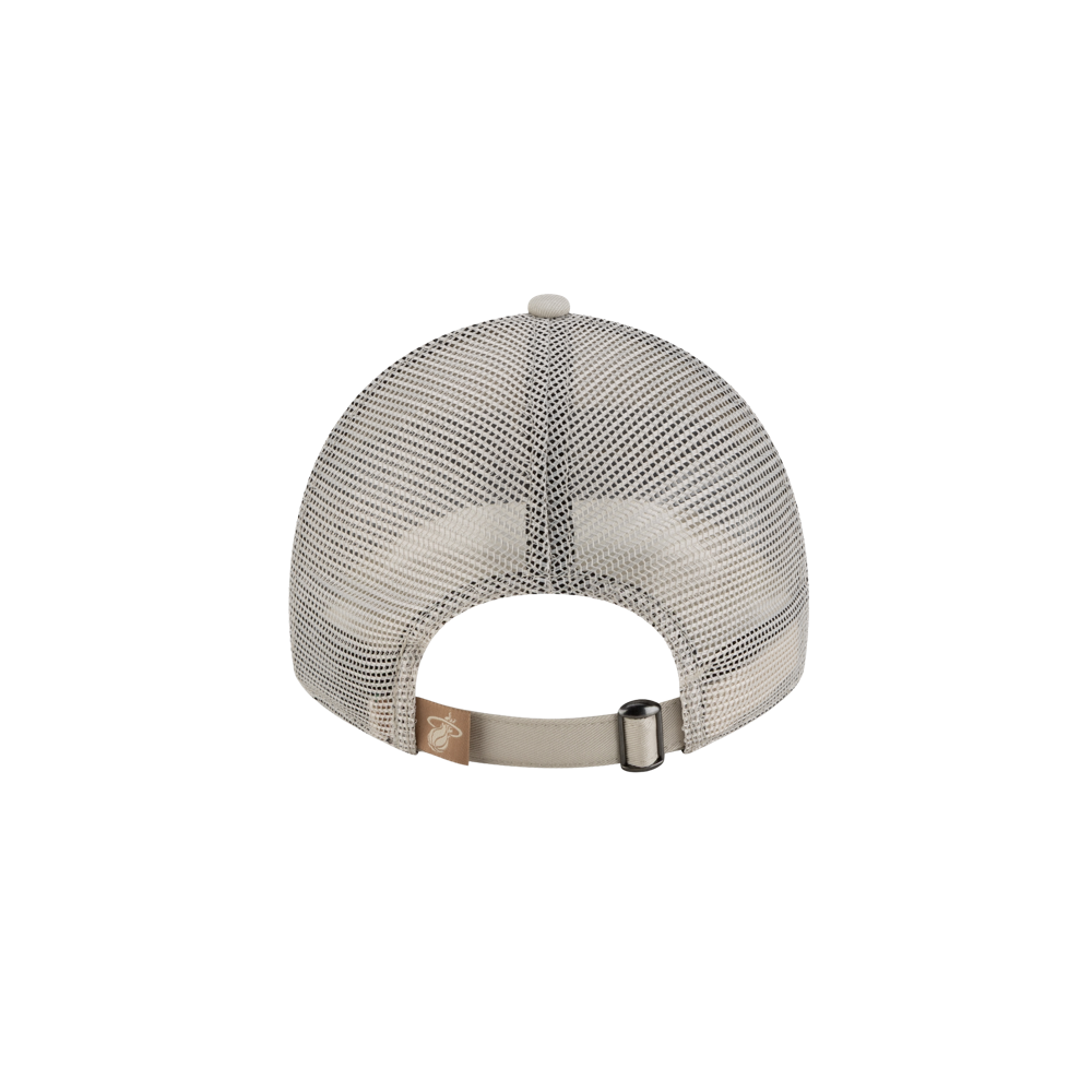 The New Era Miami HEAT Fishtail Women's Trucker Hat is a light gray mesh cap with polyester rear panels, an adjustable strap and metal buckle, plus a small brown tag on the left side of the strap.