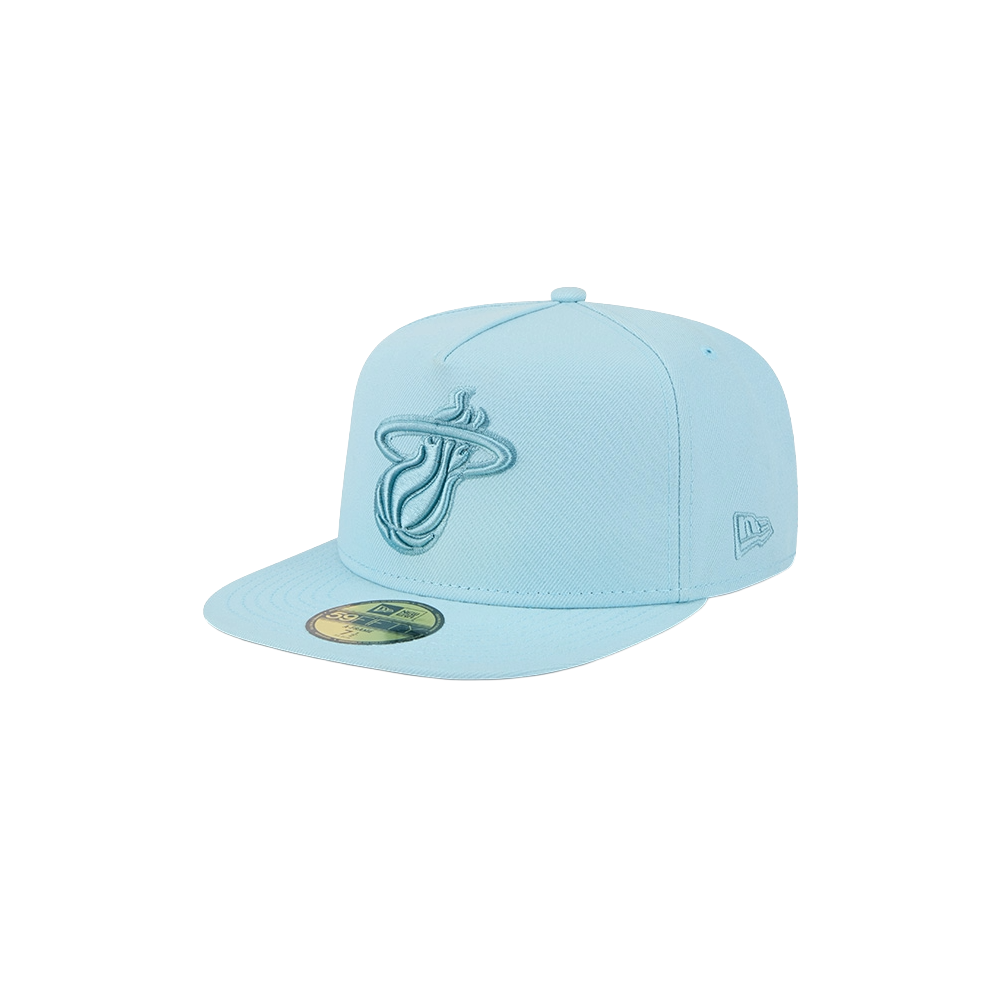 The New Era Miami HEAT Light Blue Color Pack Fitted Hat is a fitted cap with a flat brim, featuring an embroidered Miami Heat logo on the front and the New Era logo on the side.