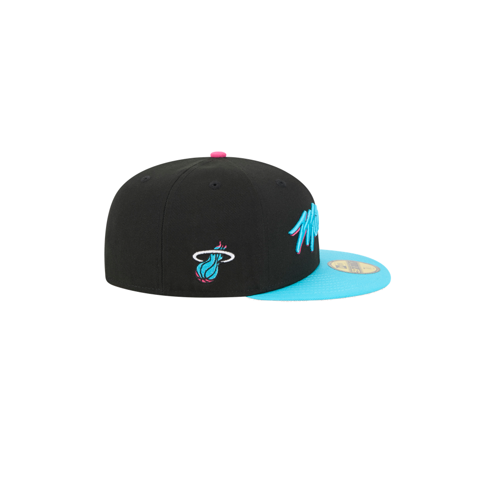 The New Era Miami HEAT Original Vice Nights Fitted Hat features a black snapback design with a light blue flat brim, pink and blue accents, the team logo on the side, and a durable polyester build that's easy to spot clean.