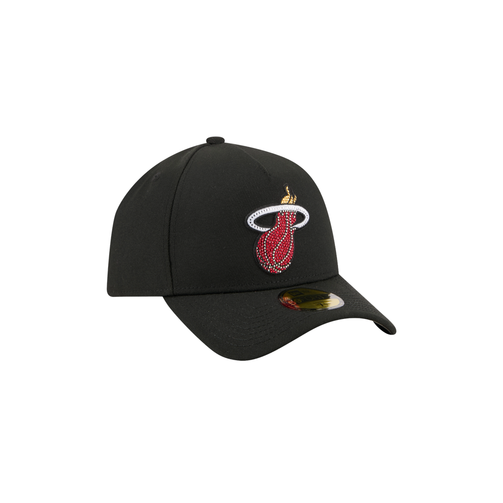 The New Era Miami HEAT 2026 Draft Fitted cap features a black design with the team's logo in red, white, and yellow on front. This polyester fitted cap by New Era has a curved brim with a gold sticker. Spot clean only. Background is plain white.