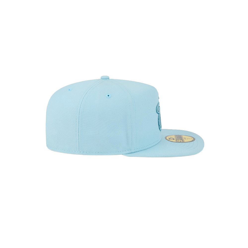 The New Era Miami HEAT Light Blue Color Pack Fitted Hat features a flat brim with a gold sticker, shown in profile against a plain white background, and minimal visible design details.