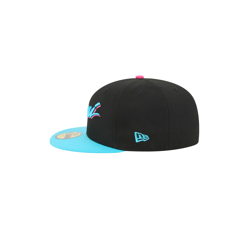 The New Era Miami HEAT Original Vice Nights Fitted Hat features a black body, bright blue flat brim, pink top button, blue New Era logo, and multicolored front design. Polyester fitted style; spot clean only. Shown from side on white background.