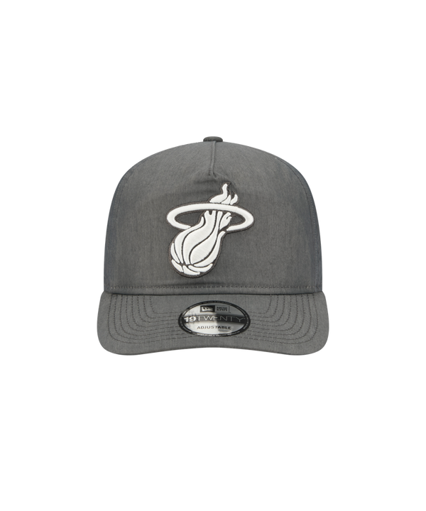 The New Era Miami HEAT Nylon Grey Snapback is a gray adjustable cotton-nylon cap with a white Miami Heat flaming logo, pre-curved visor, 