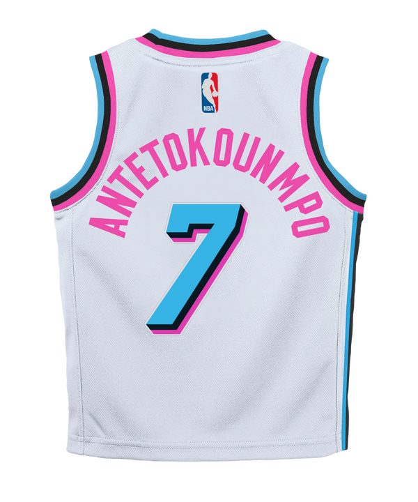 A white Giannis Antetokounmpo Nike Original Vice Toddler Replica Jersey featuring pink and blue trim, “Miami” in pink, the number 7 in blue, and Nike and NBA logos at the bottom.