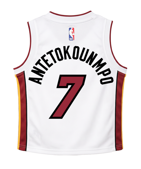 A white Giannis Antetokounmpo Nike Association Toddler Replica Jersey featuring red and yellow accents, the iconic Nike logo, and the number 7 on the front. Crafted from polyester in a standard fit, this Miami Heat jersey is easy to care for—just machine wash and wear.