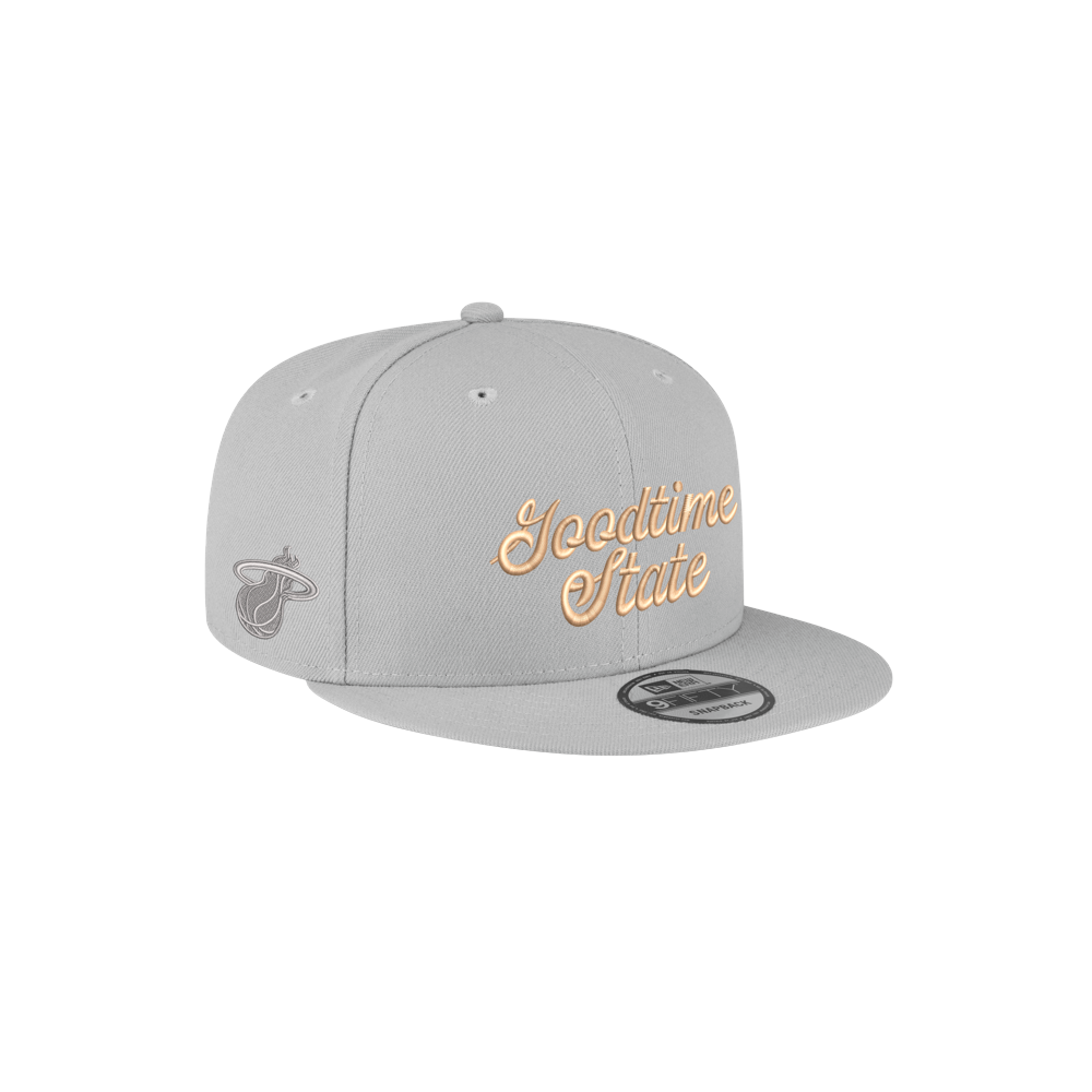 The Court Culture x New Era Vice City Goodtime State Snapback is a light gray 100% polyester hat featuring Icedtime State in gold on the front, the Miami Heat logo on the side, and an adjustable fit.